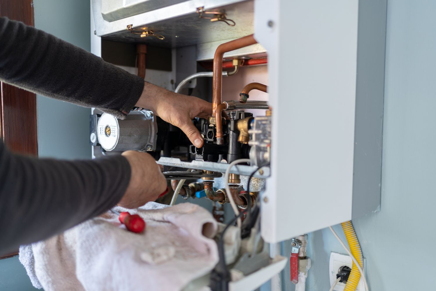 Cool Jay’s technician providing reliable furnace repair service in a Bakersfield home